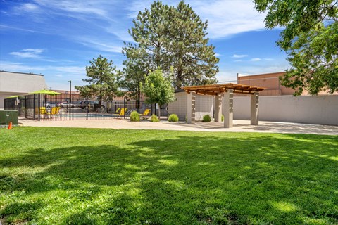 a courtyard with a gazebo and a shade